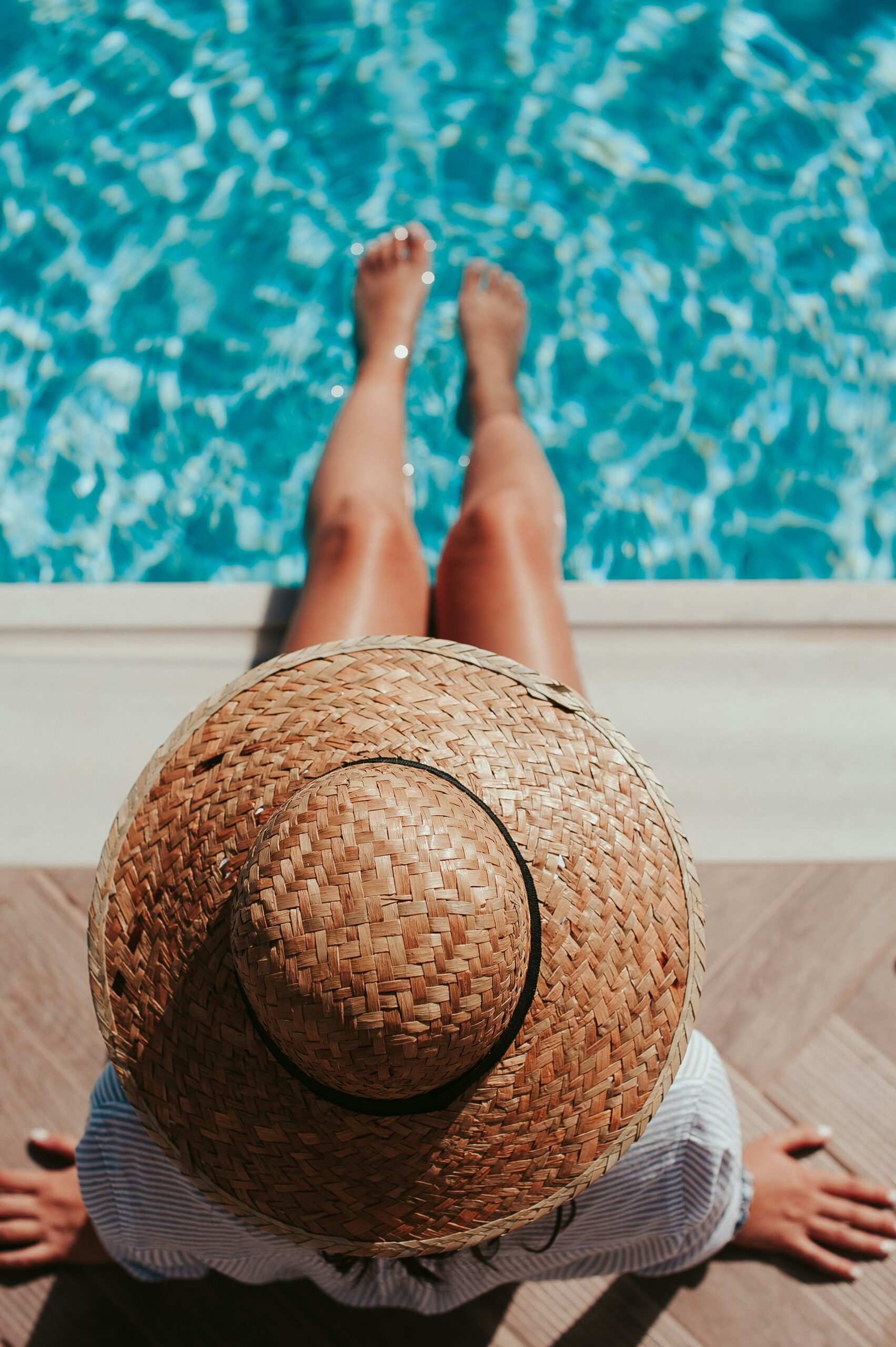 woman with legs in pool